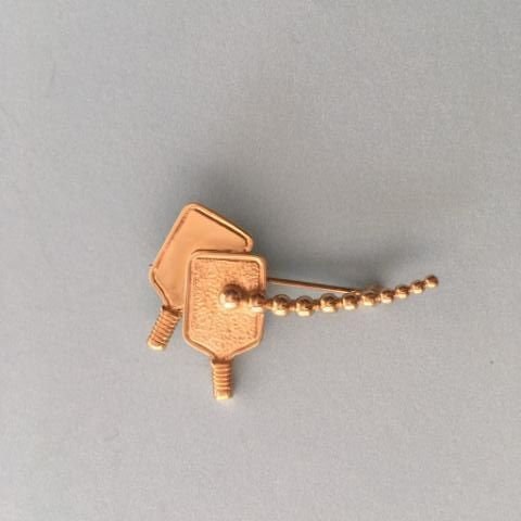 14 Kt. gold double paddle pin with "flying" ball